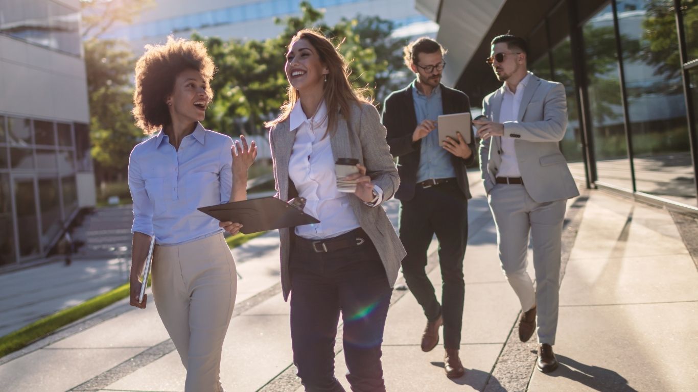 A professional team walking together outdoors