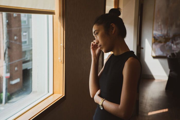 Woman standing in calm natural light