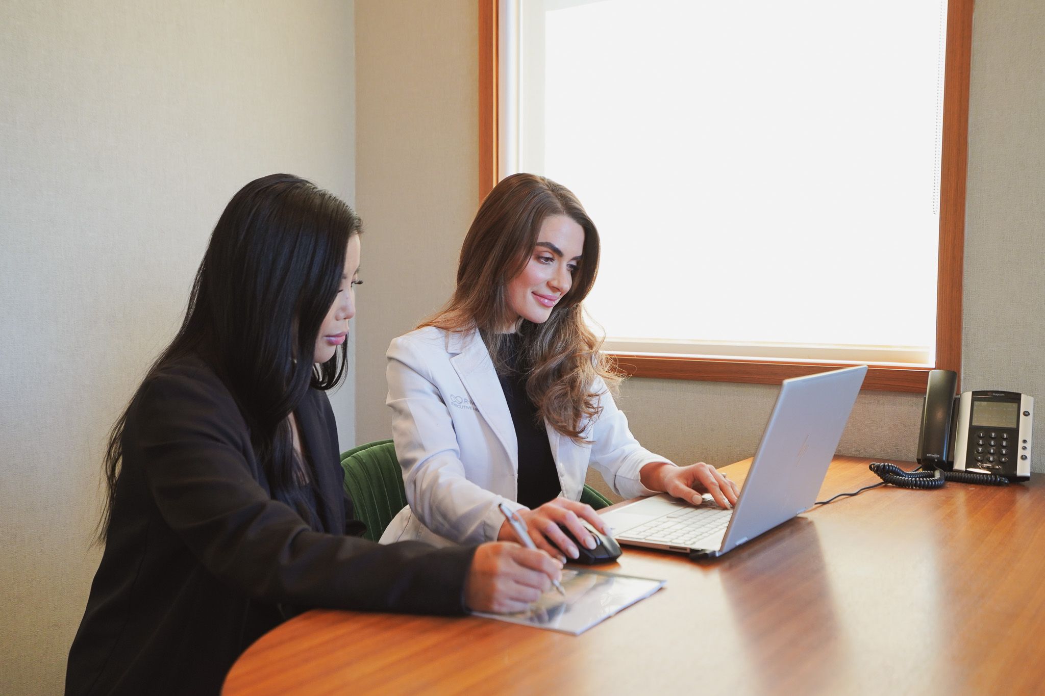 A physician consulting with a patient at R·MEDY